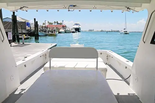 Rear View of Fishing Boat Leaving Dock