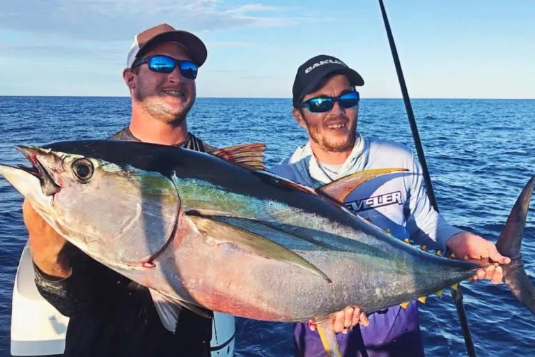 Two Man Holding Tuna Fish on Boat