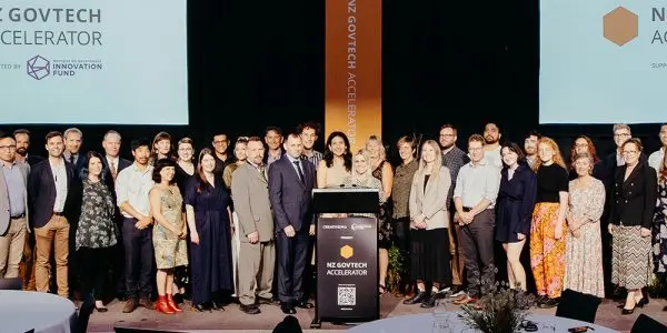 GovTech cohort 2021 posing on stage at Demo Day