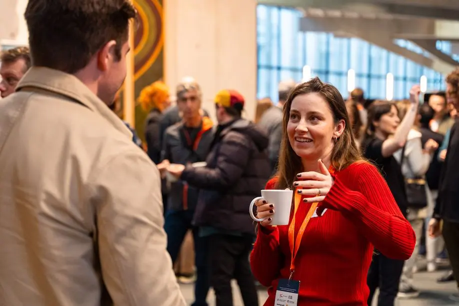 Woman at conference chatting