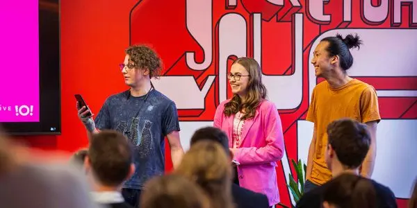 three young innovators pitching their idea at the Wellington Innovation Hack showcase