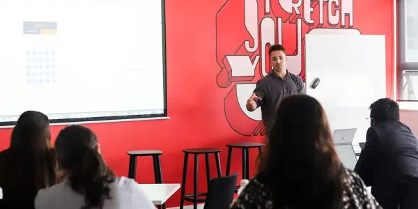 Road Guru founder presenting in front of crowd