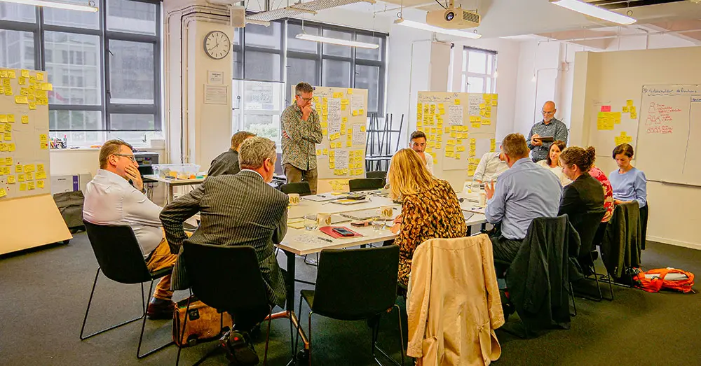Creative HQ workshop white boards sticky notes group
