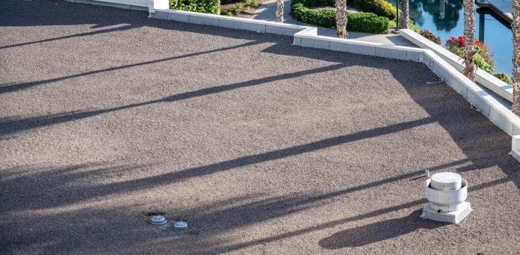 residential flat roof small rocks asphalt