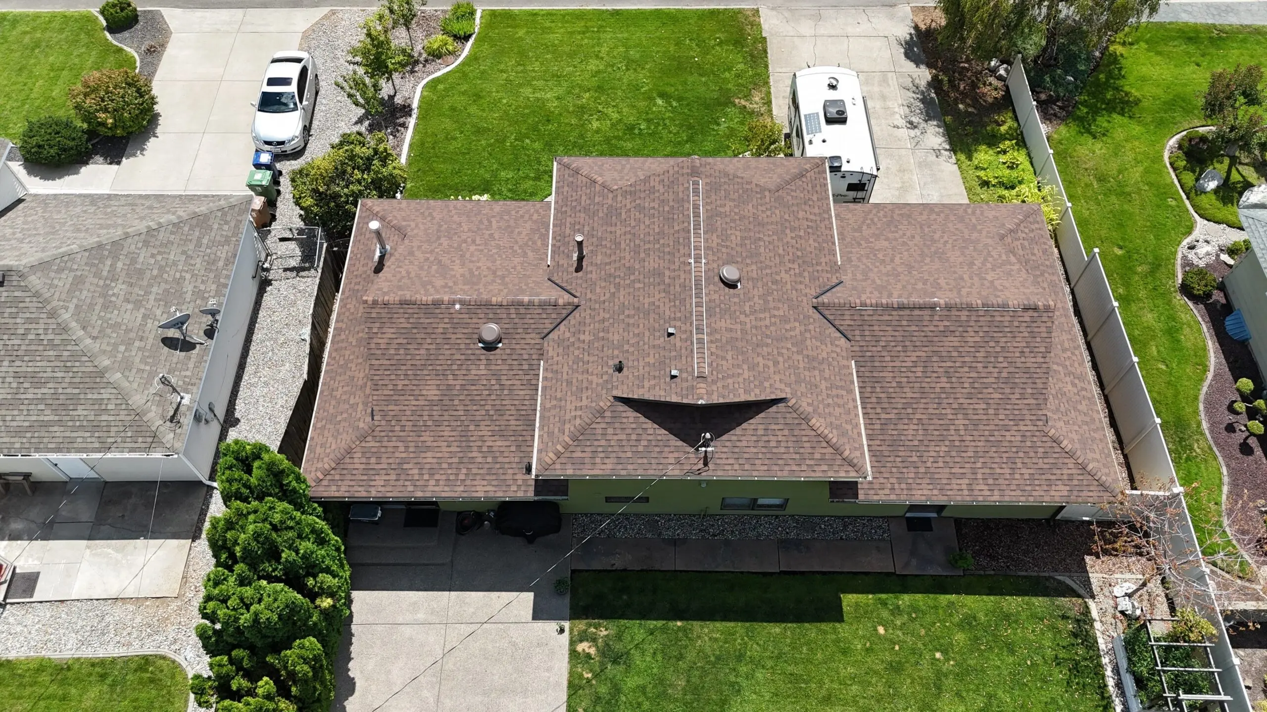 Overhead view of a beautiful suburban home in Spokane, Washington on a sunny day.