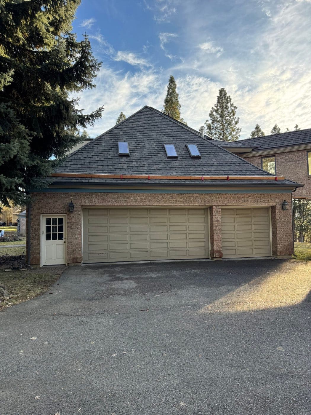 Completed asphalt shingle roof replacement by Alpine Roofing in Spokane, Washington