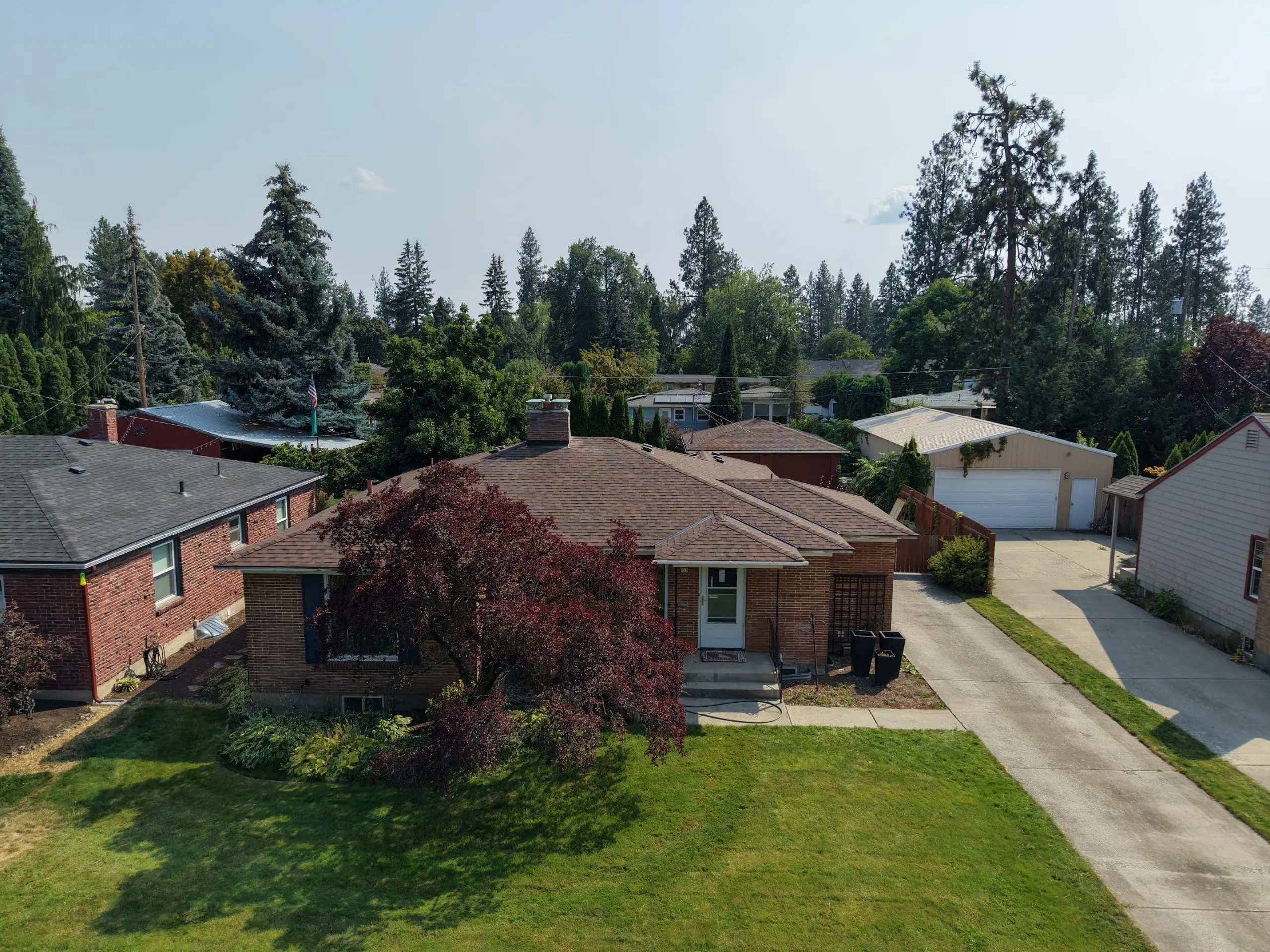 New Burnt Sienna roof replacement in South Hill Spokane on a brick rancher on W 36th Ave