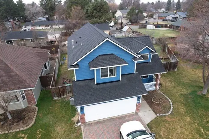 Bird's eye view of a bright blue house in Suburban Washington.