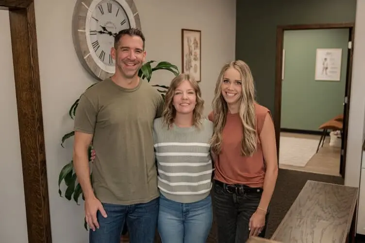 Dr. Chris, Dr. Sara, and Dr. Bailey - Rooted Chiropractic & Acupuncture team in Maize KS