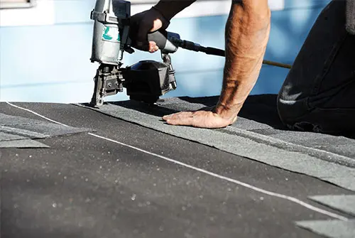 roofer working on roof top