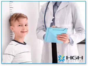Child standing in front of size chart next to Endocrinologist, HGH Deficiency,