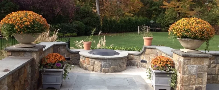 how can a retaining wall be designed to enhance a backyard paver patio in scarsdale, ny