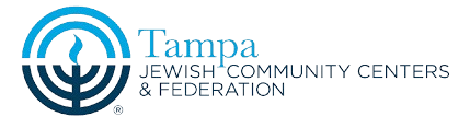The blue and navy logo of the Tampa Jewish Community Centers and Federation, a proud community partner and supported organization of Tampa Turf Services.