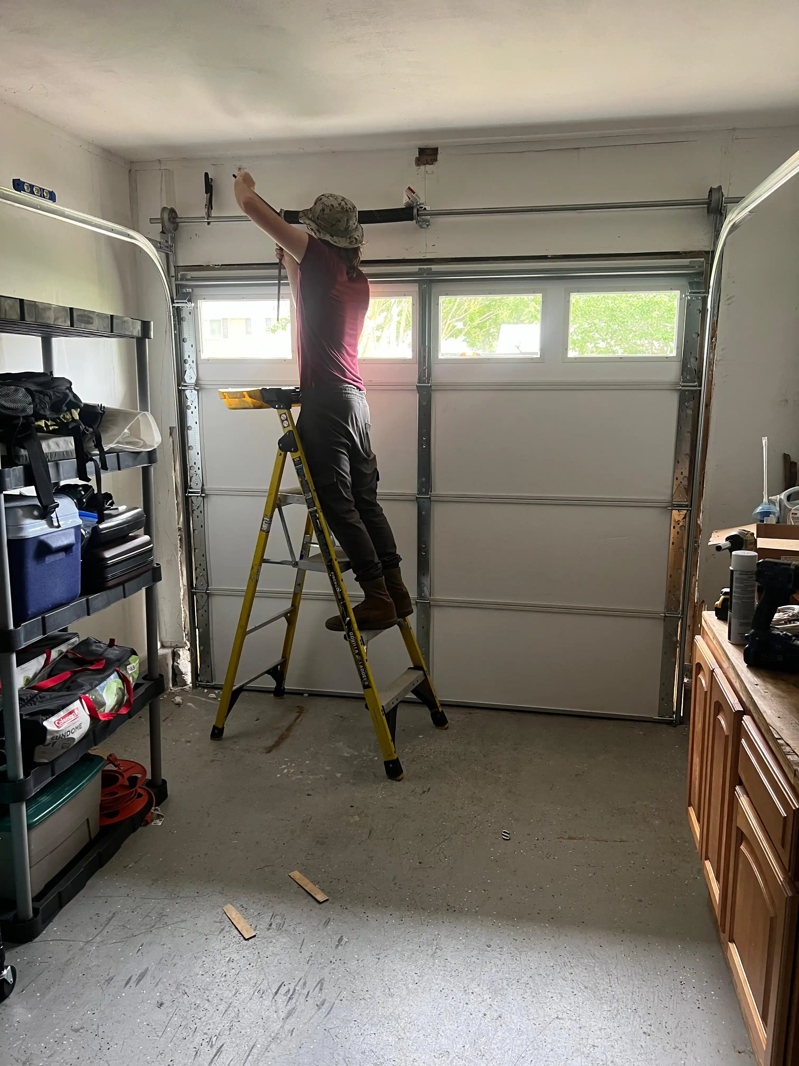 person working on garage door