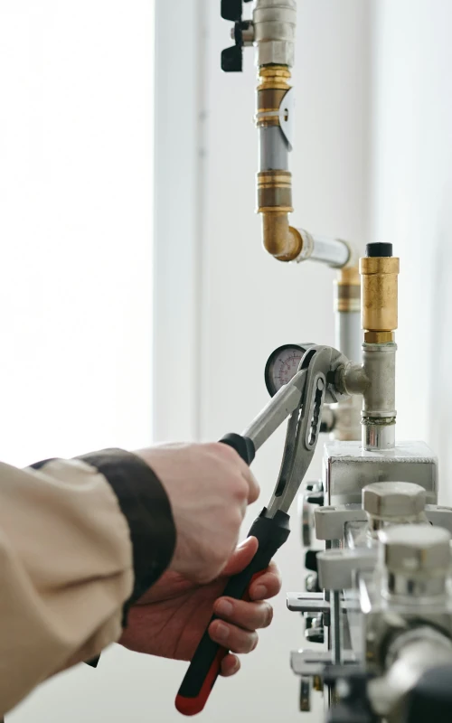 a professional installing a water treatment system