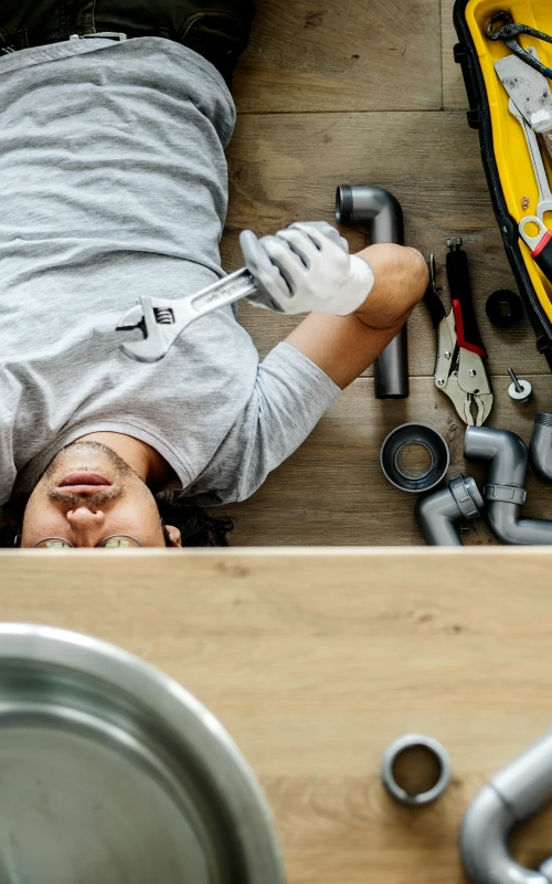 professional kitchen plumbing repairing the sink