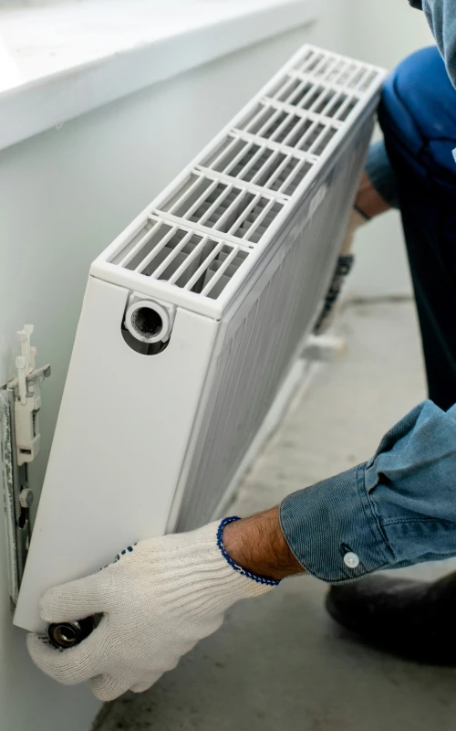 professional installing a radiator (2)