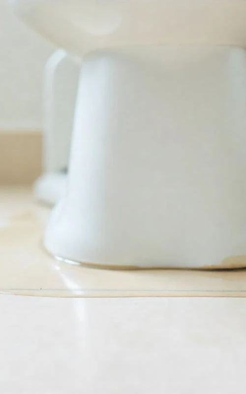 water leaks around the base of a toilet