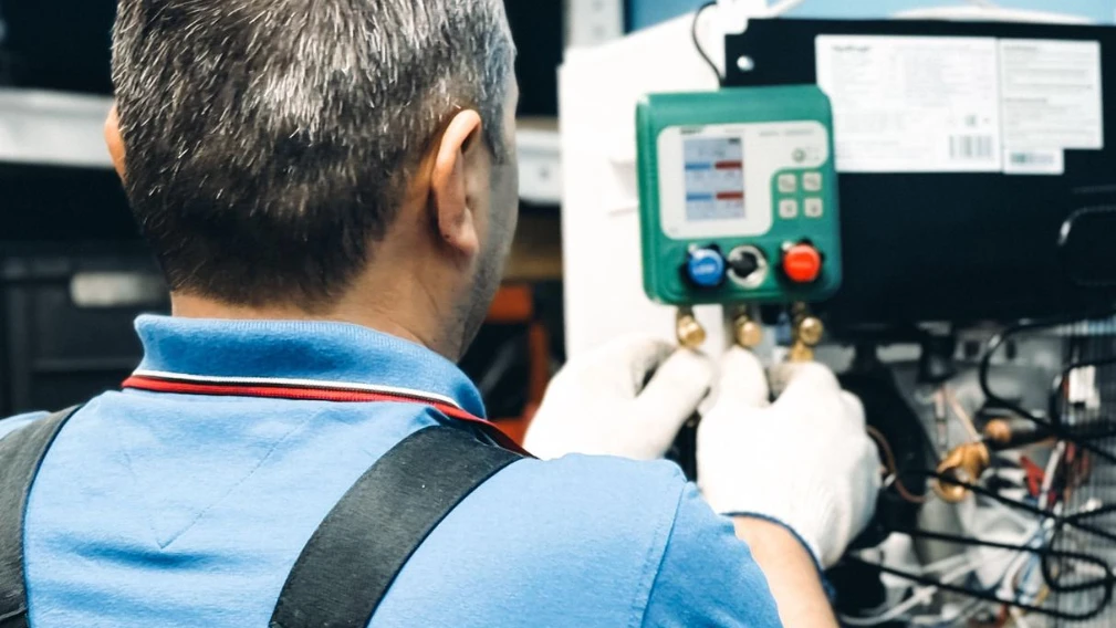 HVAC technician performing maintenance to improve system airflow and efficiency