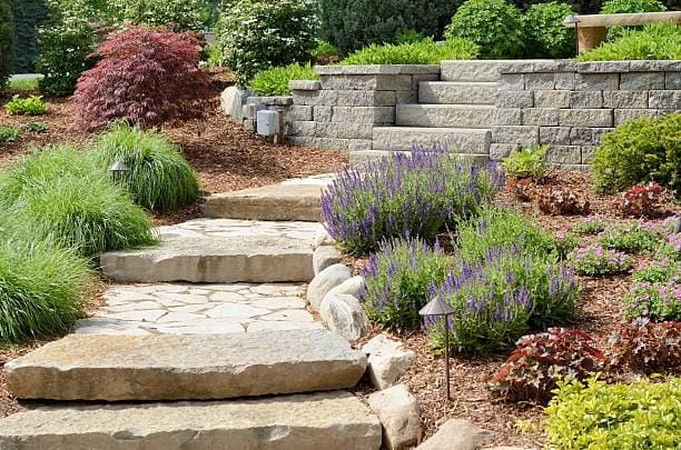 Why Landscaping Professionals Rely on Roll-Off Dumpsters for Dirt, Concrete, and Brush Hauling
