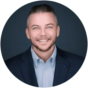Daniel Gallegly corporate executive headshot within blue circle background