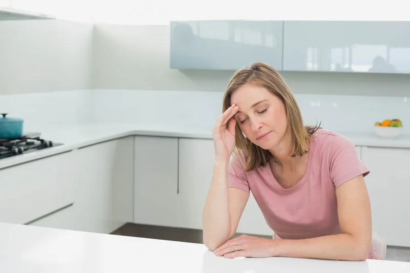 stressed woman in kitchen