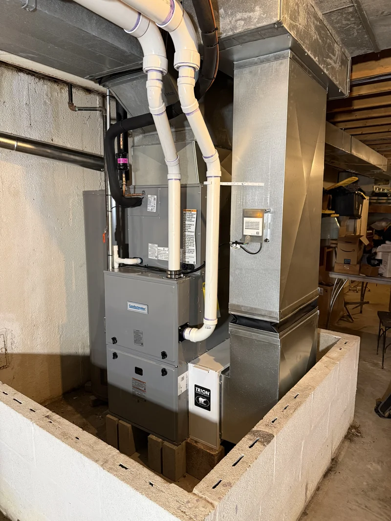 hvac pipes with ductwork in utility room