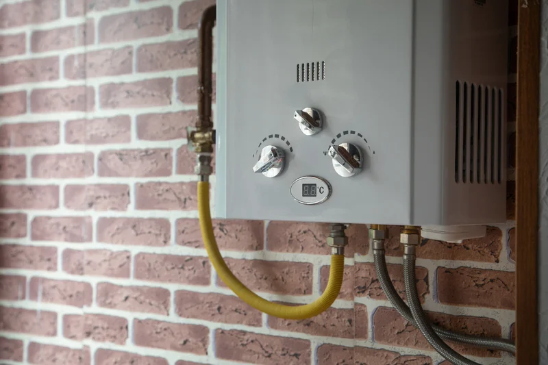 water heaters gas boiler on brick wall with yellow gas line
