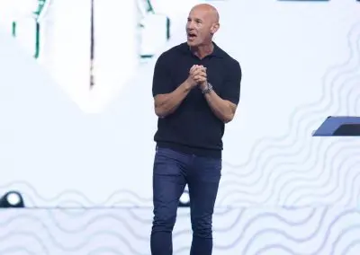 pastor tj on stage teaching a sermon