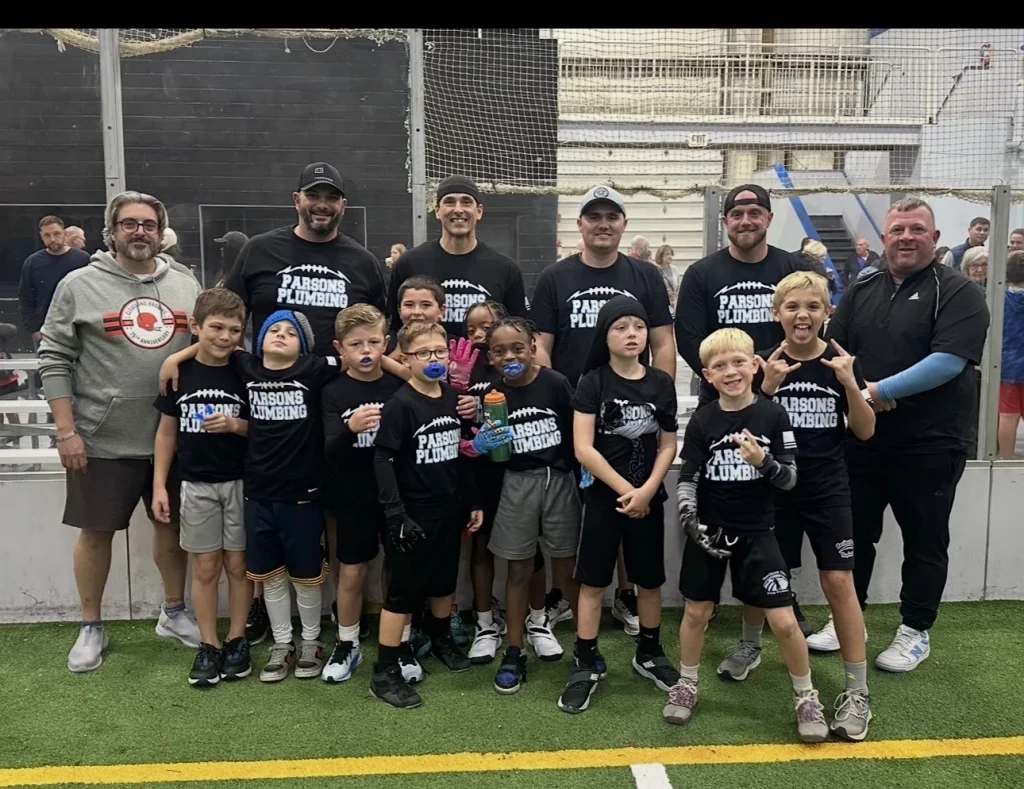 Kids soccer team wearing Parsons Plumbing shirts