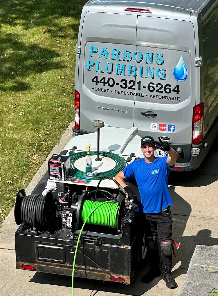aerial view of parsons plumbing van and worker
