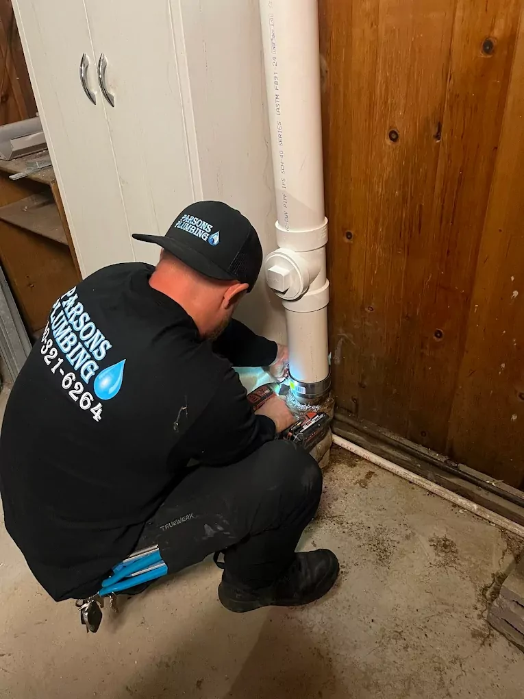 parsons plumbing worker installing pipes