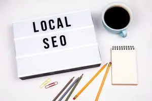local seo text in lightbox white desk with stationery