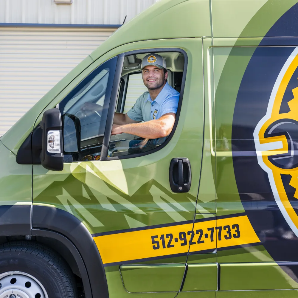Summit AC crew member driving a company van
