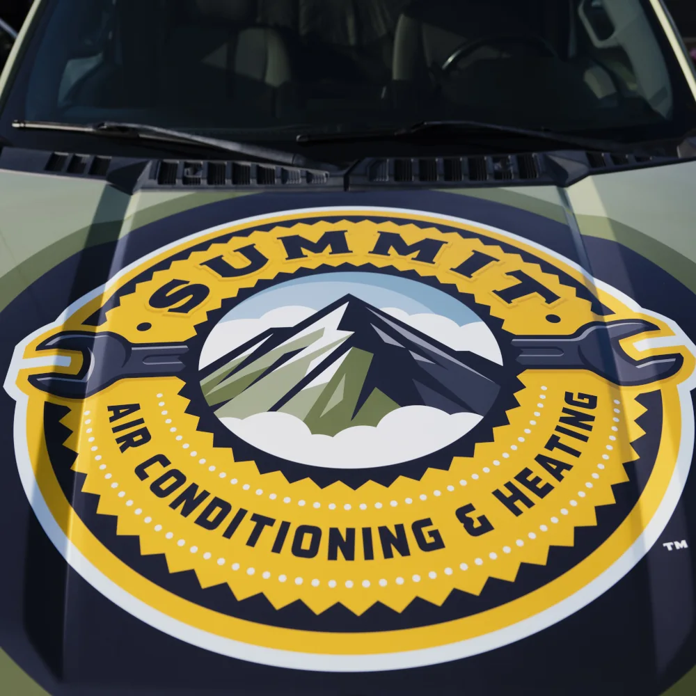 Summit Air Conditioning & Heating logo on a company vehicle