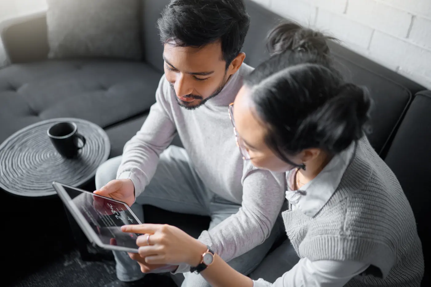 Couple controlling indoor temperature using a tablet