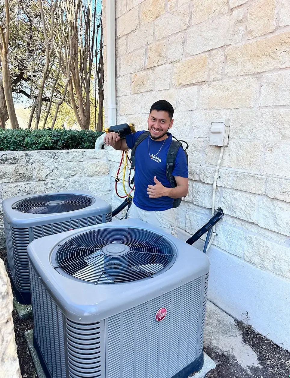 Technician repairing residential air conditioner