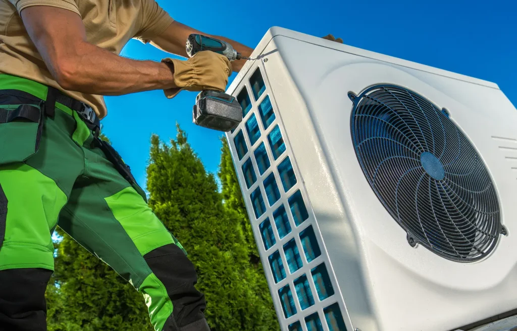 Technician installing AC