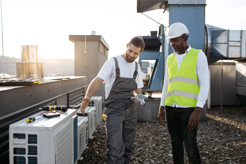 Professionals inspecting HVAC equipment