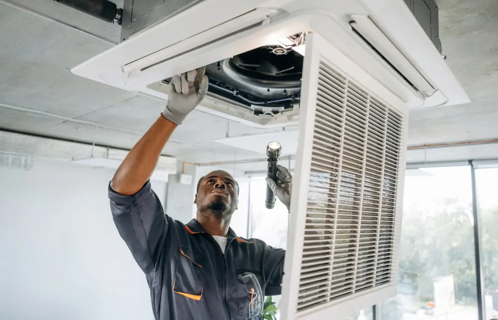 Technician Repairing Garage AC