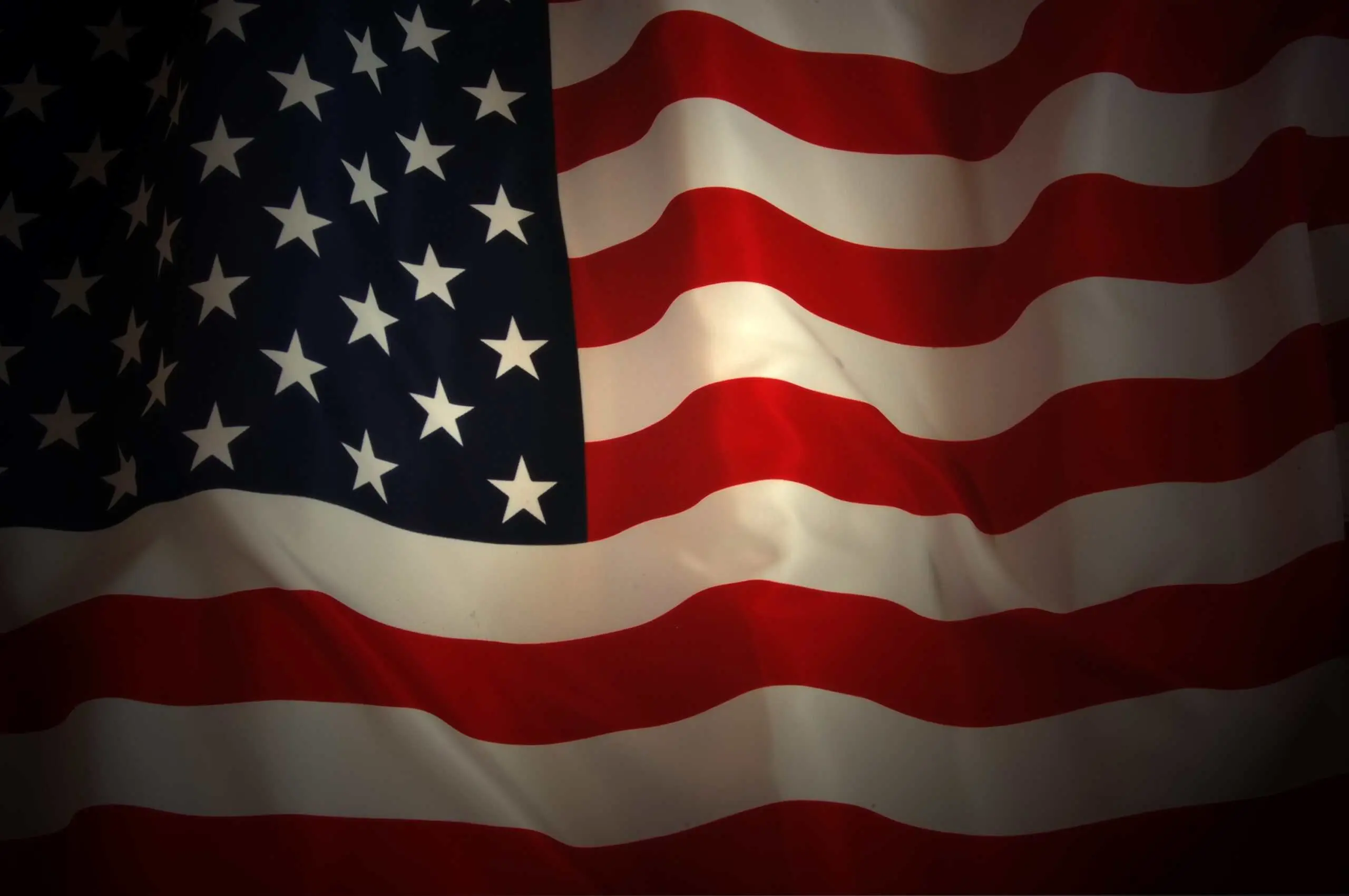 American flag waving in the wind Flag of the United States with stars and stripes.