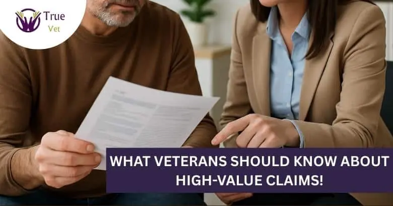 Veteran and advisor reviewing VA claim document Veteran and advisor discussing VA disability claim paperwork.
