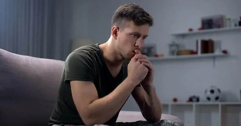 Thinking about VA disability claims Man contemplating VA disability benefits.
