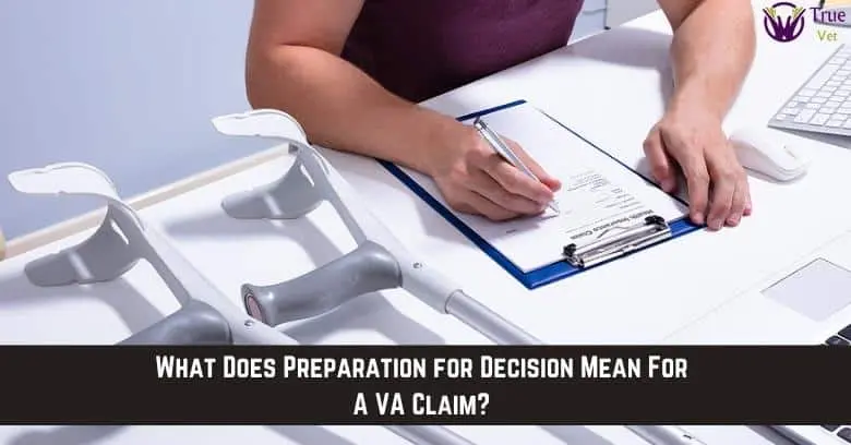 Veteran reviewing VA claim documents at desk Veteran reviewing VA disability claim documents with crutches nearby.