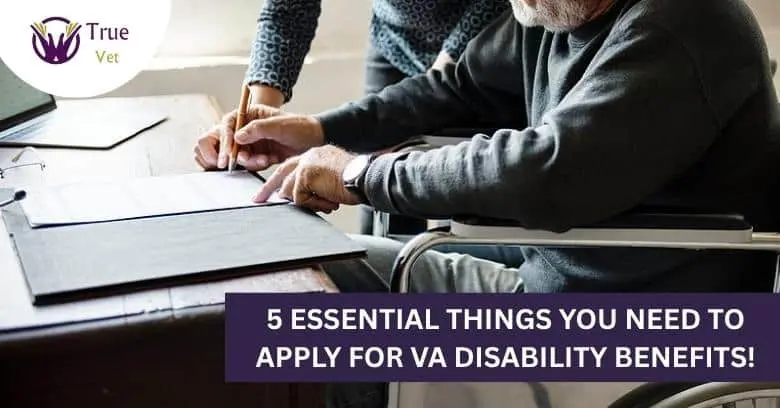 Veteran reviewing VA disability claim documents Veteran and counselor reviewing VA disability claim paperwork at a desk.