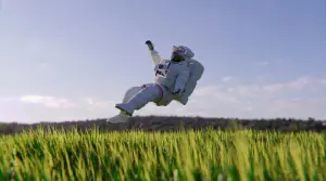 Astronaut floating on grass