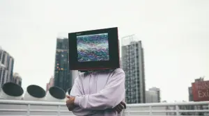 person with a computer monitor as a head