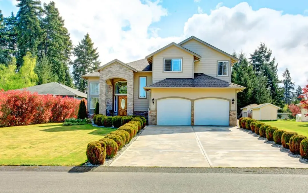 Big siding house with garage and high column porch in Mid Hillside.