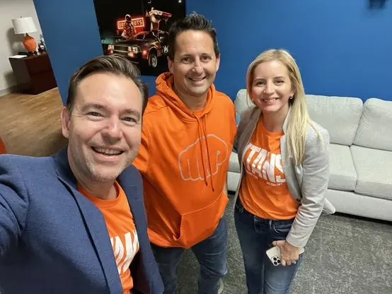 Matt with Josh and Yesenia Nelson at the Seven Figure Agency office