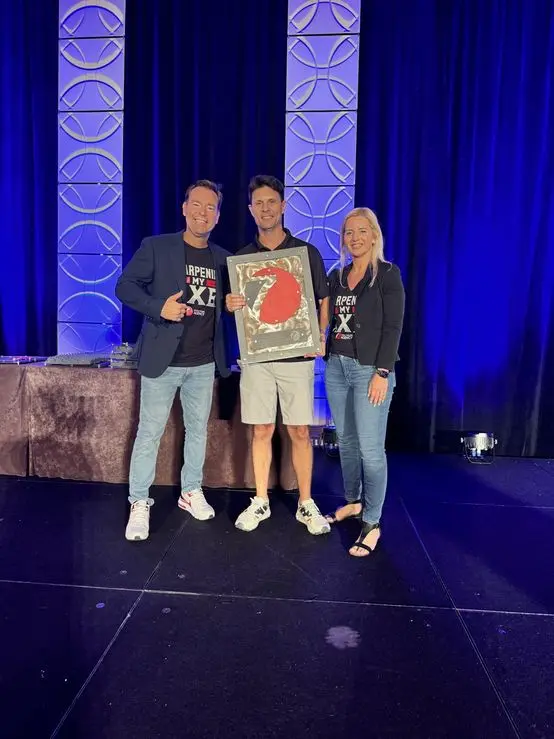 Accepting an award on stage with Josh and Yesenia Nelson